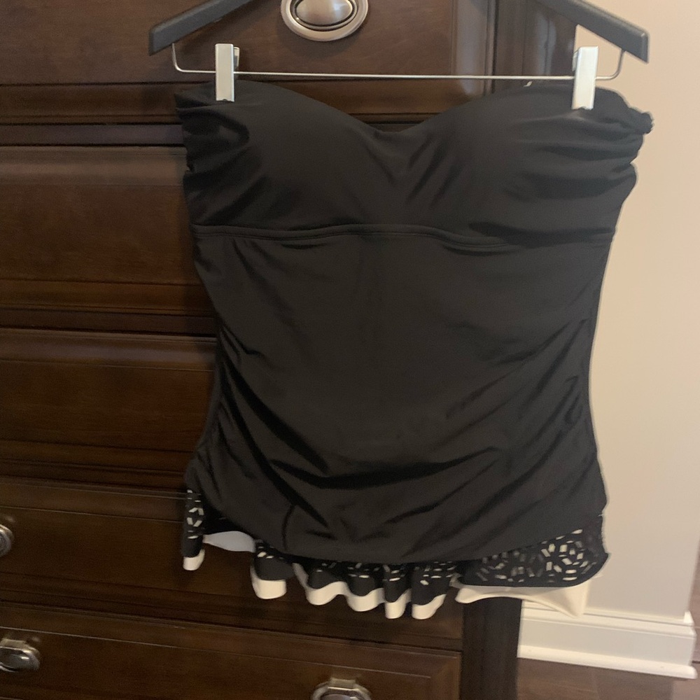 Black one piece swim suit with attached skirt. SizeXL